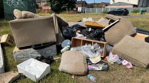 BBC Pile of fly-tipped rubbish in Derby