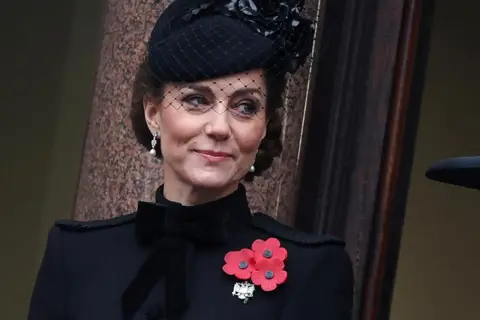 Reuters Britain's Catherine, Princess of Wales, smiles as she stands from the balcony during the National Service of Remembrance at The Cenotaph in London, Britain, November 10, 2024.