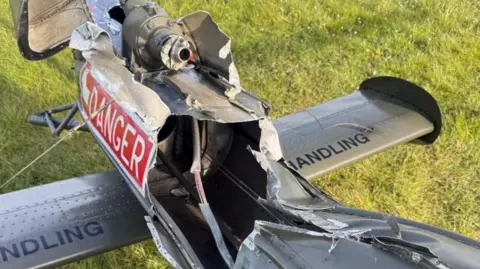 Air Accidents Investigation Branch The tail of a helicopter ripped open with a cables inside exposed