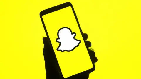 SOPA Images Snapchat on phone