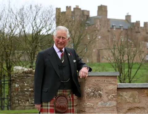 PA Media Prince Charles, The Duke of Rothesay as he is known in Scotland poses for a photograph in front of the Castle of Mey after he officially opened the Granary Accommodation at The Castle of Mey