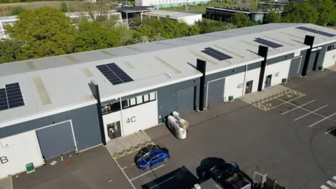 An aerial photograph of the company's base on a business park on the edge of Luton