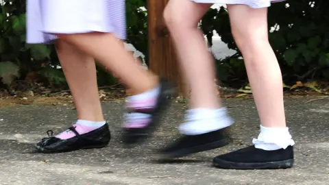 Two children walking 