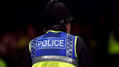 PA Media A police officer on the beat