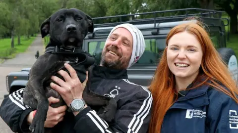 A client and their dog with Hannah Brunton of Vets in the Community