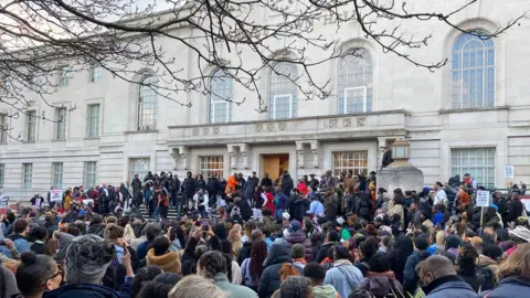 BBC  Crowds gathered outside Hackney town hall