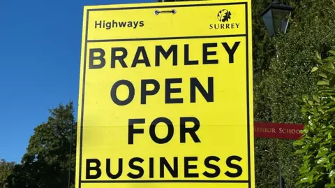 A Surrey County Council sign said Bramley is open for business