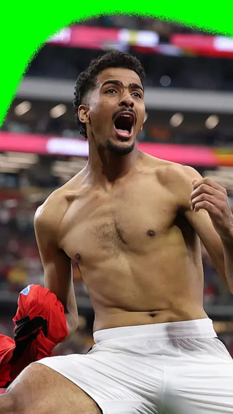 Hossam Abdelmaguid rips his shirt off after scoring the winning penalty for Egypt against Australia in the 2026 World Cup.