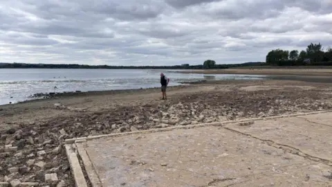 The old foundations of a former Bungalow on the edge of Rutland Water, which is usually submerged but has been revealed by lower water levels.