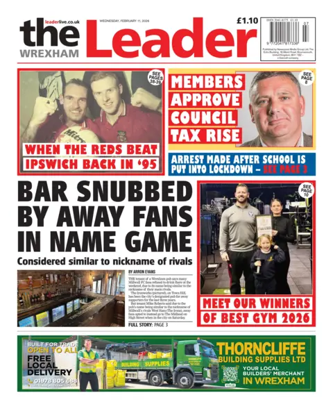 Wrexham Leader Front page of the Wrexham Leader shows main headline "Bar snubbed by away fans in name game" next to an image of a bar with fridges filled with beer and drinks and bottles of spirits. Other headlines read: "Arrest made after school is put into lockdown", "Members approve council tax rise", "When the reds beat Ipswich back in '95", "Meet our winners of best gym 2026". 