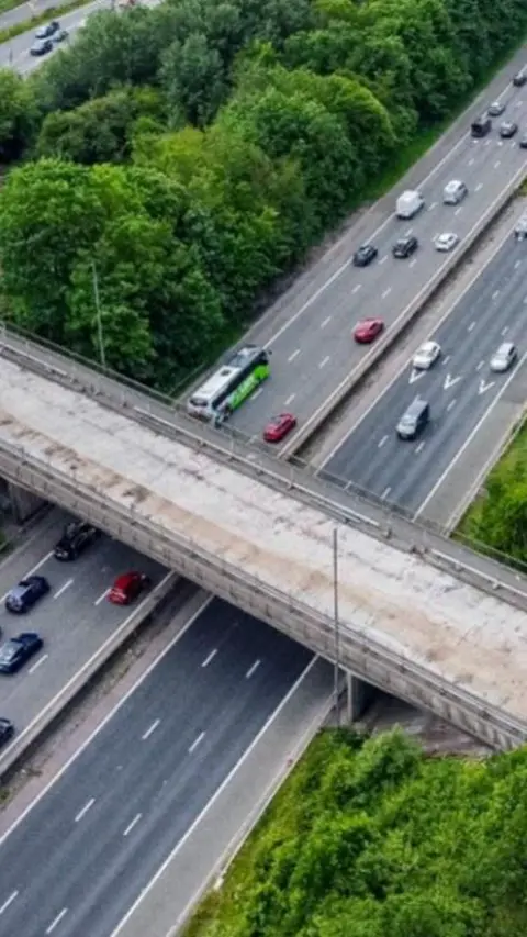 Drone shot of a bridge over a motorway.