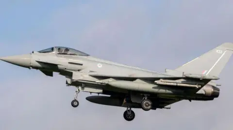 Jon Hobley/Getty Images Royal Air Force Eurofighter Typhoon coming into land at RAF Coningsby. It has the number 433 on the tail fin and the RAF's red, white and blue circular emblem behind the cockpit.