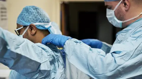 Getty Images Two medics in scrubs