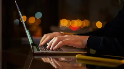 Getty Images Man on laptop