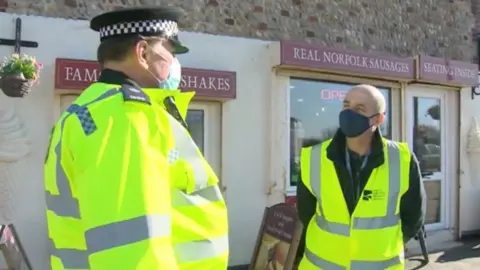 Police patrols in Sea Palling on Sunday.