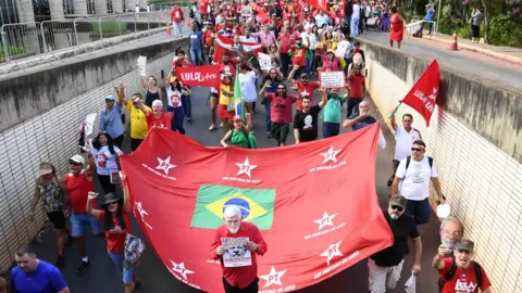 AFP/Getty Lula's supporters massed outside the Electoral Supreme Court in Brasilia August 2018