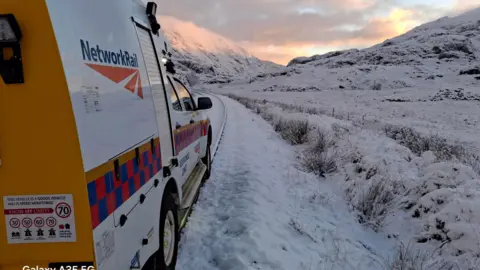 A road-rail vehicle inspecting the route between Mallaig and Fort William in the snow 