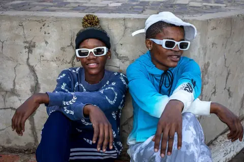 Per-Anders Pettersson / Getty Images Riders wait for a best bike look contest during a bicycle gathering and competition on June 14, 2025 in Alabama, a township outside Klerksdorp, South Africa. 