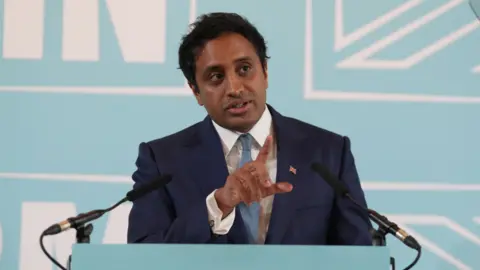 Reform UK home affairs spokesman Zia Yusuf speaking during a press conference in central London