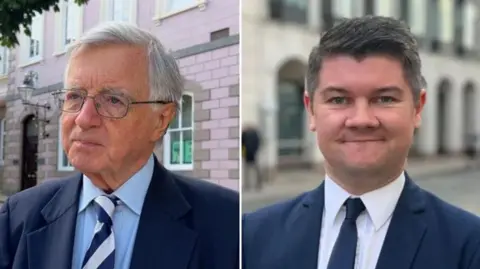 BBC Deputies Sir Philip Bailhache and Sam Mezec both wearing blue suits and light coloured shirts.