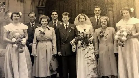 Family handout A black and white picture of the wedding party in 1952