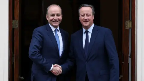 PA Media Tánaiste Micheál Martin and UK Foreign Secretary Lord Cameron