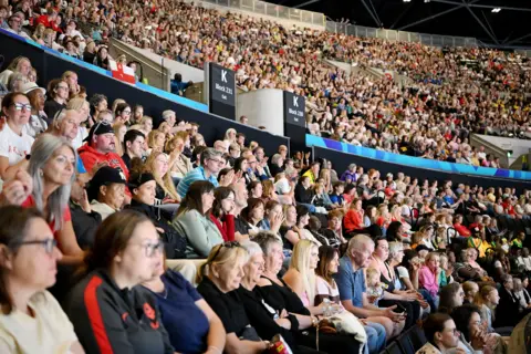 Getty Images Thousands of fans watching the Games.