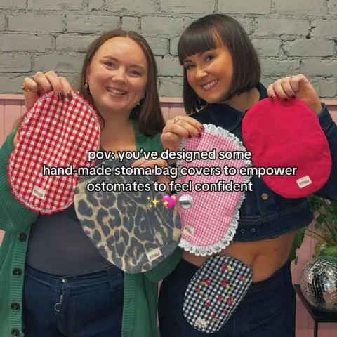 LUCYJANE.FASHION/INSTAGRAM Two women hold up a range of stylised stoma bags and smile into the camera.