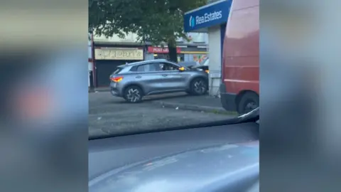 Ron McDowell Silver car rammed into Rea Estate agents in Woodvale Belfast