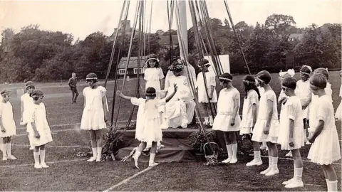 The Bournville Society Dancing around the maypole