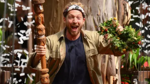 James Gourley/ITV/Shutterstock Sam Thompson celebrating his win on I'm A Celebrity