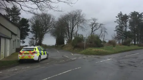 BBC A police car at the Synod Inn incident