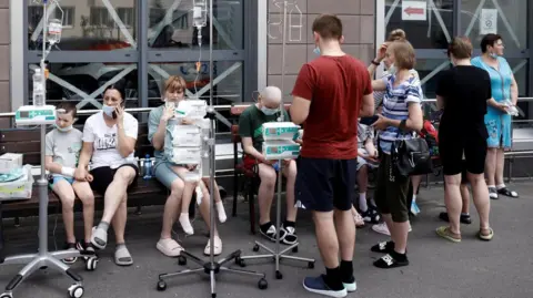 Reuters Child patients on drips wait to be evacuated after the strike on the Ohmatdyt hospital in Kyiv. Photo: 8 July 2024