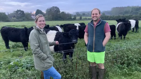 Luke Deal/BBC Farmers Livvy Colton and Lewis Gidney with their cows