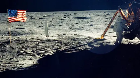 NASA One of the few photographs of Neil Armstrong on the moon shows him working on his space craft on the lunar surface