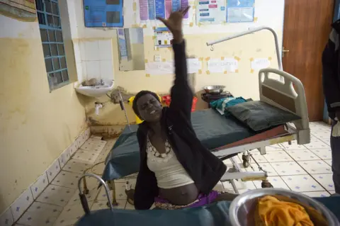 Bieke Depoorter / Magnum Nelly in the last stages of her labour which was natural and without pain relief.