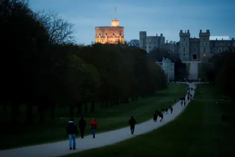 Reuters People gather to bring flowers after Britain"s Prince Philip, husband of Queen Elizabeth, died at the age of 99, in Windsor, near London, Britain, April 9, 2021. REUTERS/Andrew Boyers