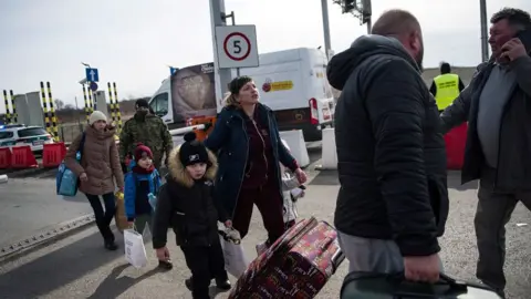 Getty Images Refugees arriving at the Polish border of Medyka