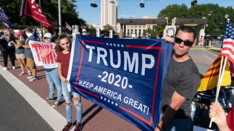 Getty Images Supporters of U.S. President Donald Trump rally outside Walter Reed National Military Medical Center on October 3, 2020 in Bethesda, Maryland.