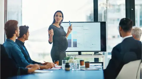 Getty Images Pregnant women holds meeting