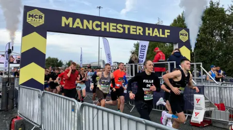 BBC Runners set off under a black and yellow start sign