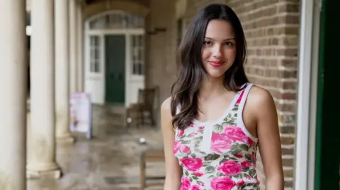 Olivia Rodrigo poses outside The Old Kitchen of the 17th Century stately home, Kenwood House