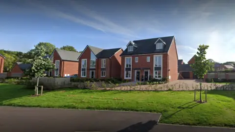 red brick houses with grey slate tiles on the roof