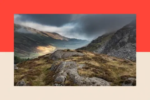 Getty Images Autumn landscape image of view along Nant Fracon valley in Yr Wydffa, Snowdonia National Park, with dramatic evening sky 
