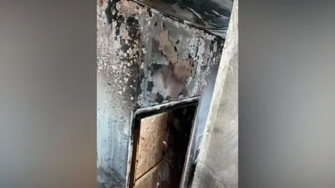 Emily-Rose Hinnells Charred room in house. The damage is extensive.