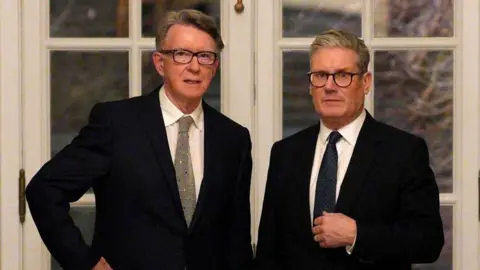 Mandelson and Starmer standing together in February 2025