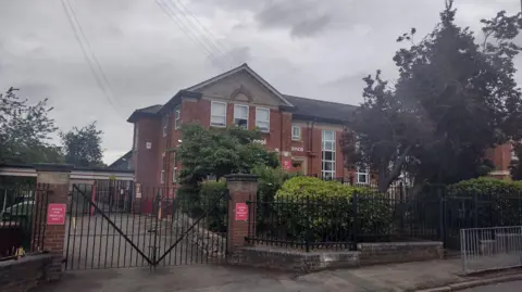 Supplied A large red brick school building