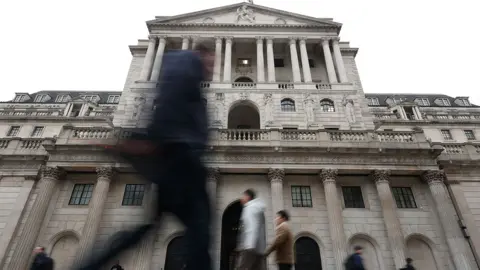 Reuters People walk past the Bank of England on an overcast day in Bank, London, on 3 February