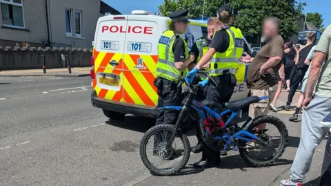 Fife Jammer Locations Police officers, a police van and an electric dirt bike