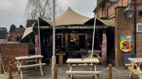 The Star Inn A view closer to the pub outside shows the tented marquee over the outside space. There are tables inside it as well as in front of it. The marquee is linked to the exterior of the pub itself.